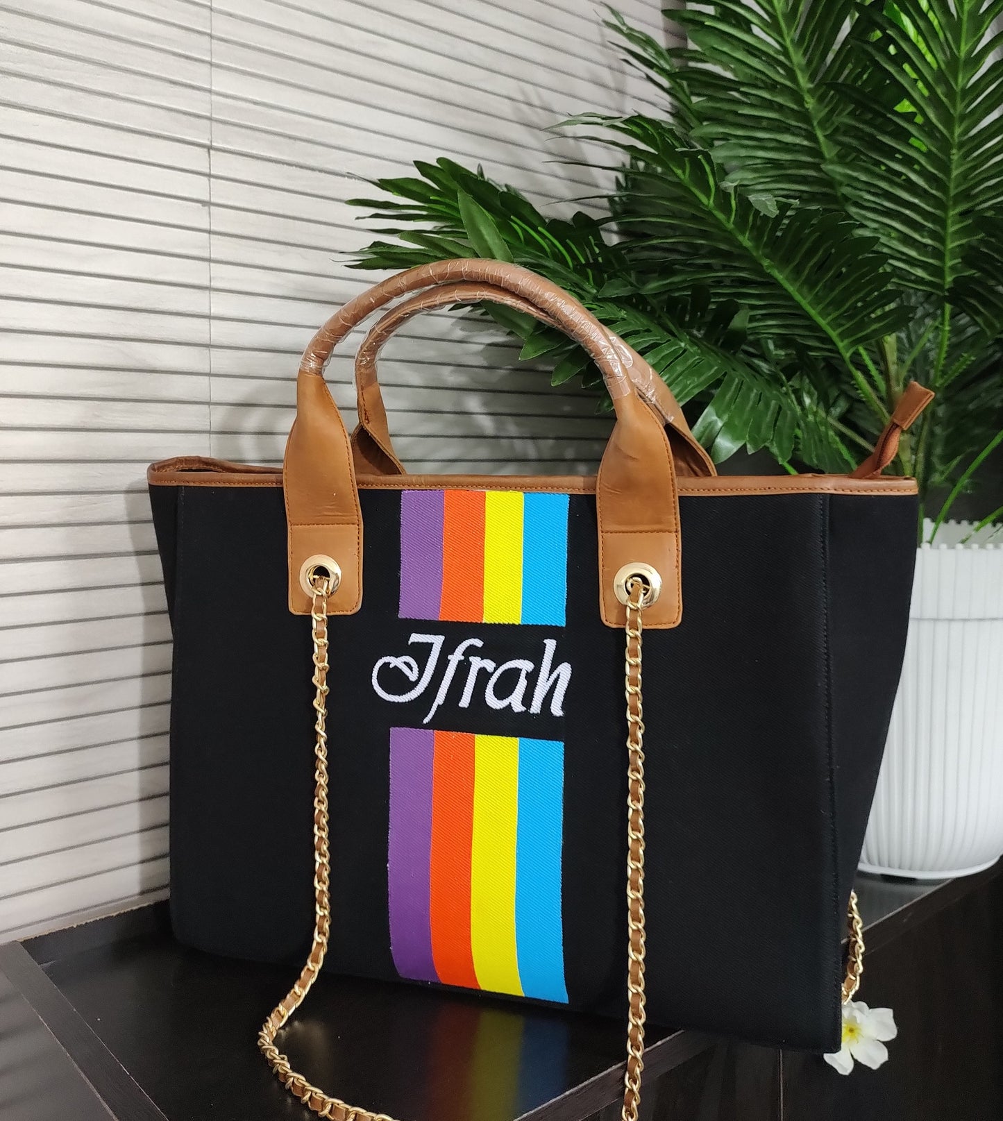 Black bag with multicolor stripes