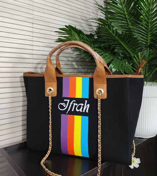 Black bag with multicolor stripes