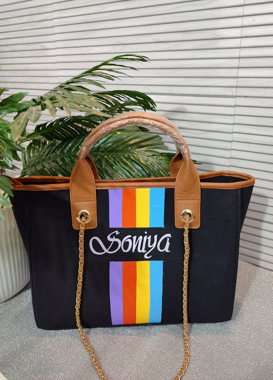 Black Bag with purple, orange, yellow and blue stripes