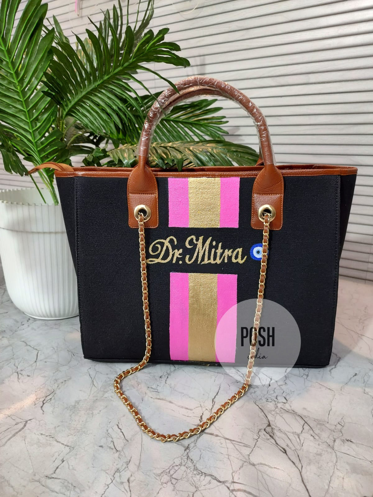 Black tote with hot pink and golden stripes