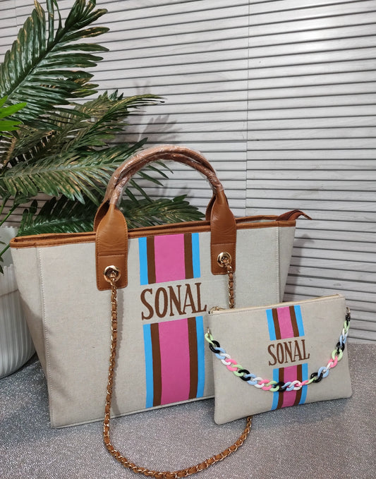 Dark beige bag with blue, brown and pink stripes