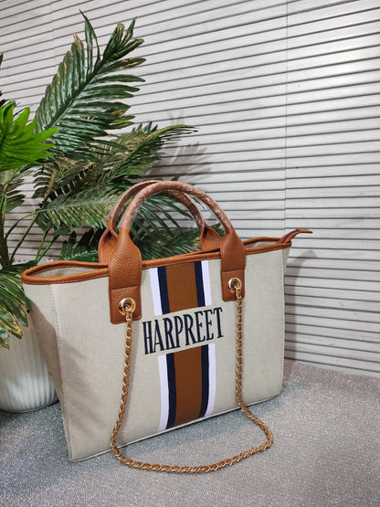 Dark beige bag with white, brown, navy stripes