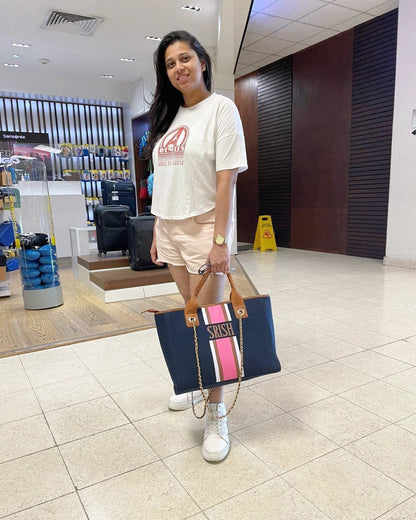 Navy blue tote with white, brown and pink stripes