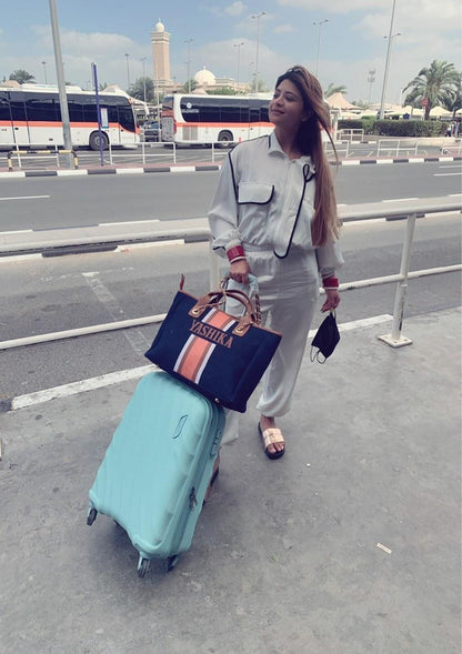 Navy blue tote with white, brown and orange stripes