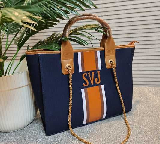 Navy blue tote with white, brown and brown stripes