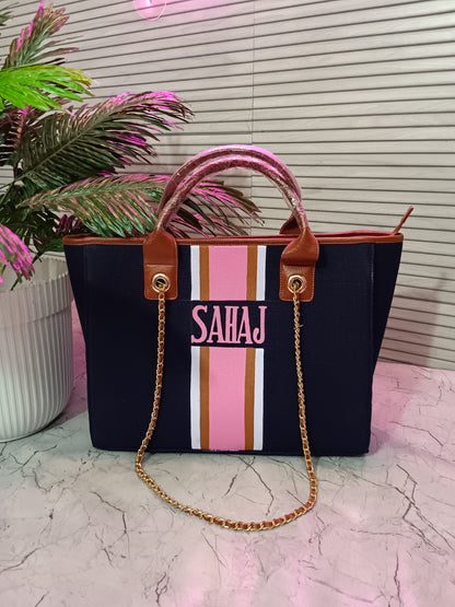 Navy blue tote with white, brown and pink stripes