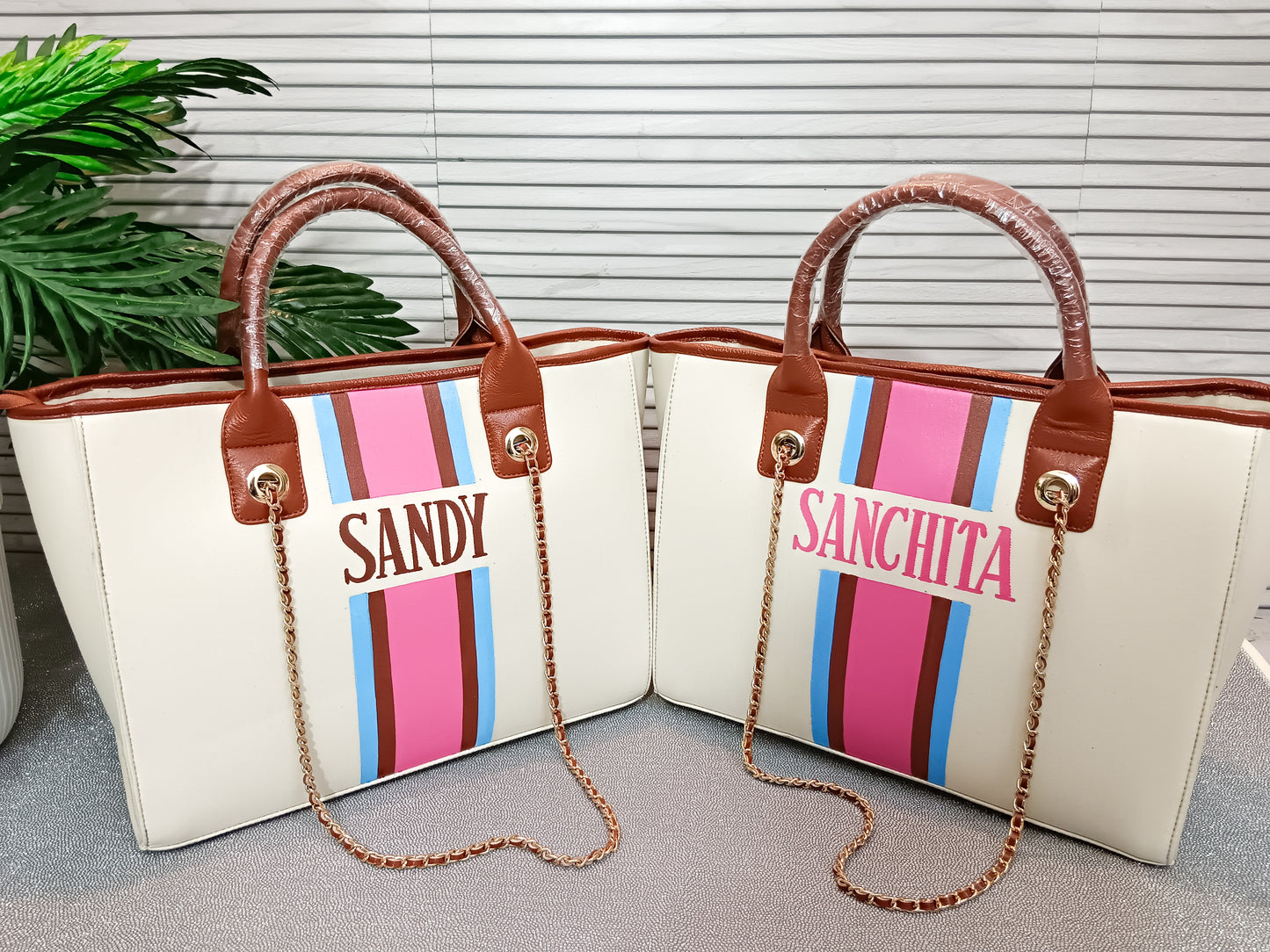 Off-white bag with sky blue, brown and pink stripes