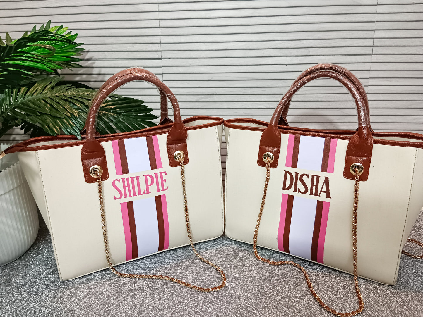 Off-white bag with pink, brown and white stripes