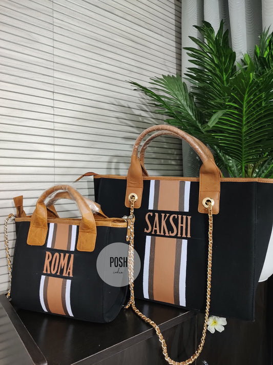 Black mini bag with white, dark brown and light brown stripes