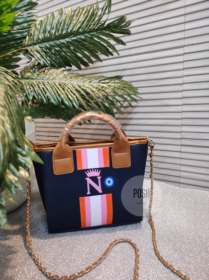 Navy blue mini tote with orange, baby pink and white stripes